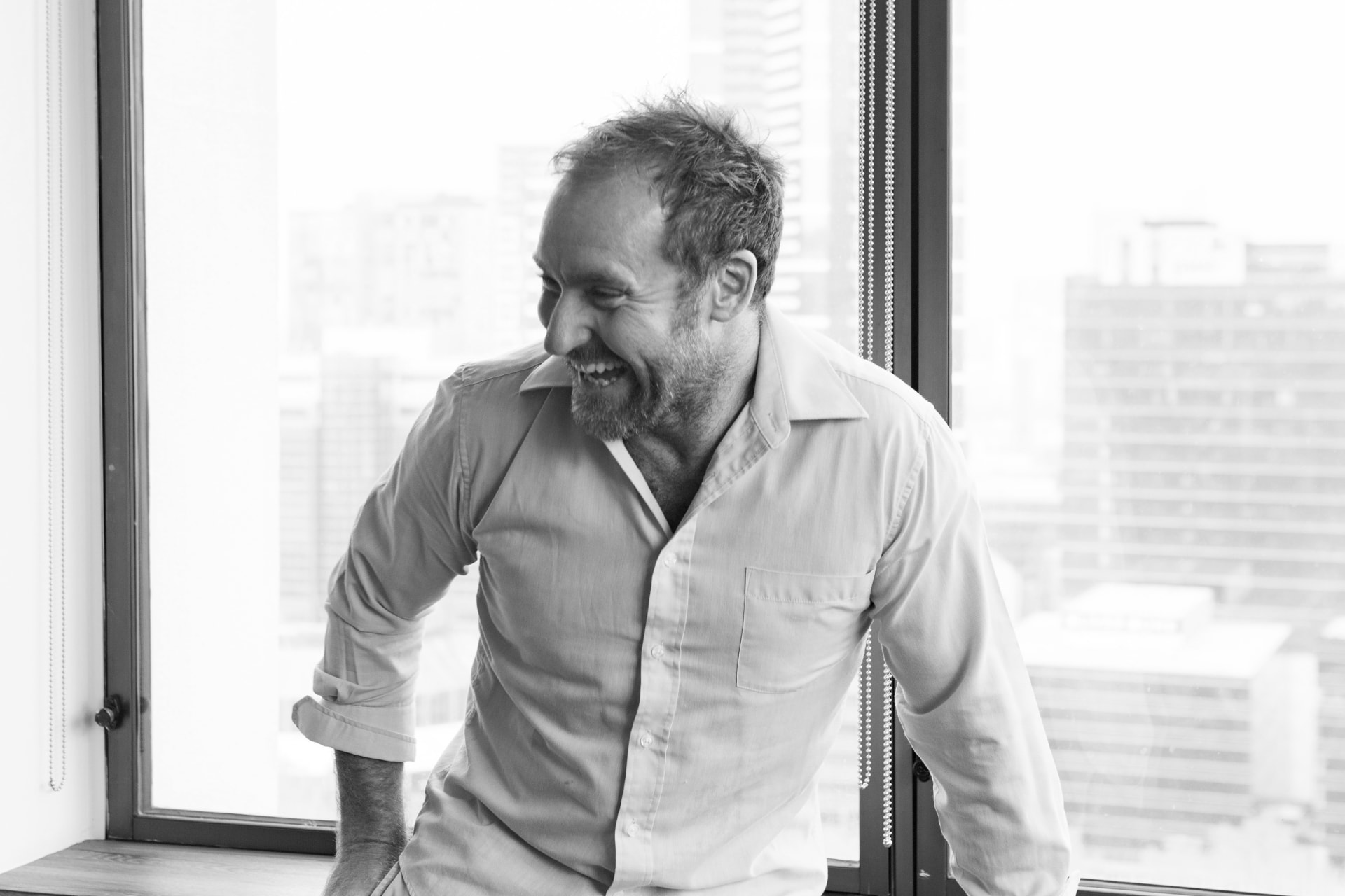 Daniel Frith in a candid black-and-white portrait.